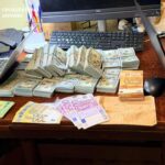 Понад 22,6 млн грн готівки, елітні авто та зброю вилучили під час масштабних обшуків у топпосадовців Нацполіції